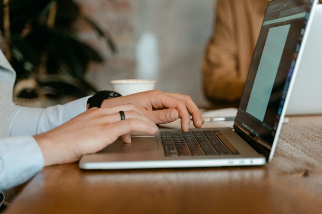 Woman typing on a laptop